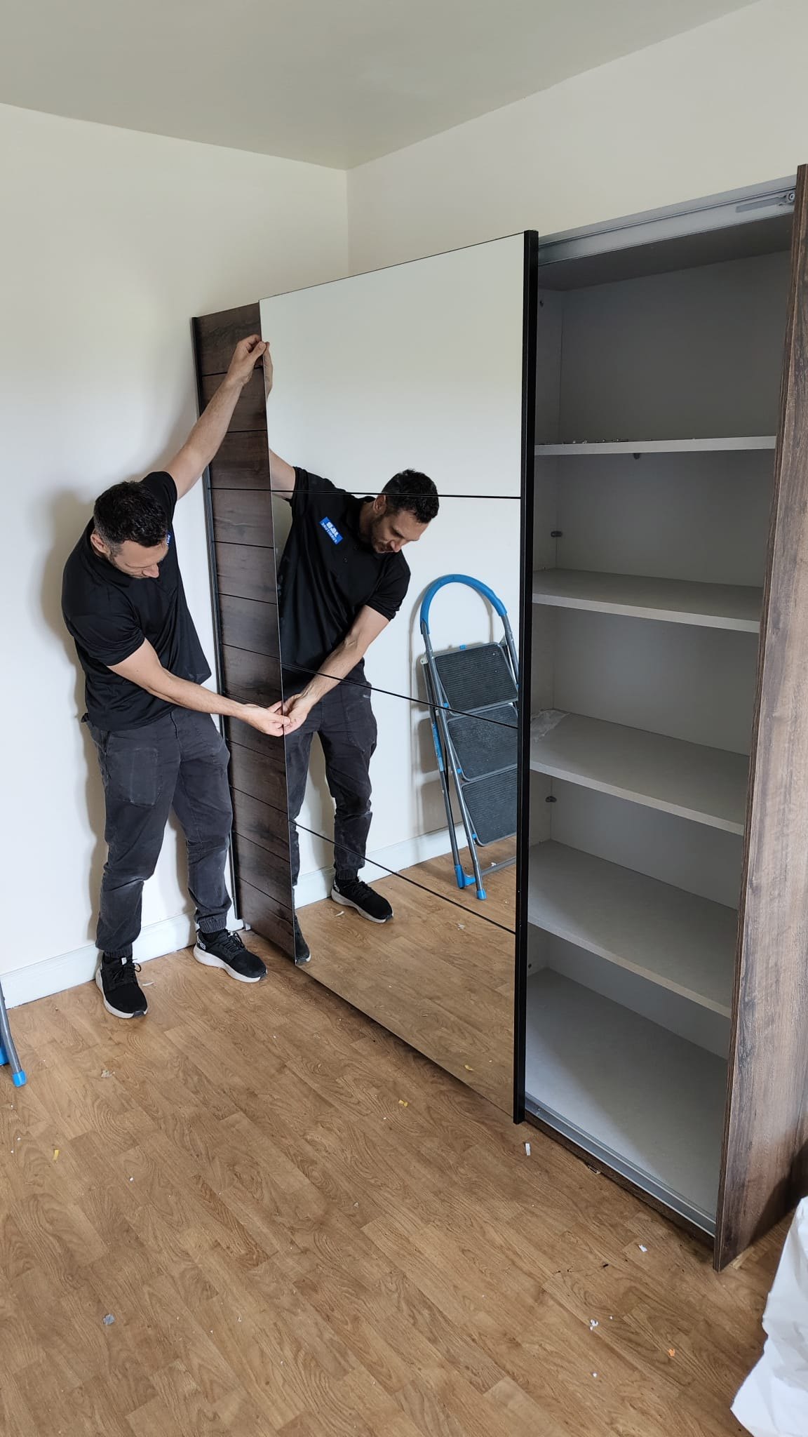 J&B Furniture installer assembling wardrobe